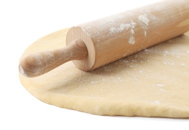 Photo of Raw dough and rolling pin isolated on white