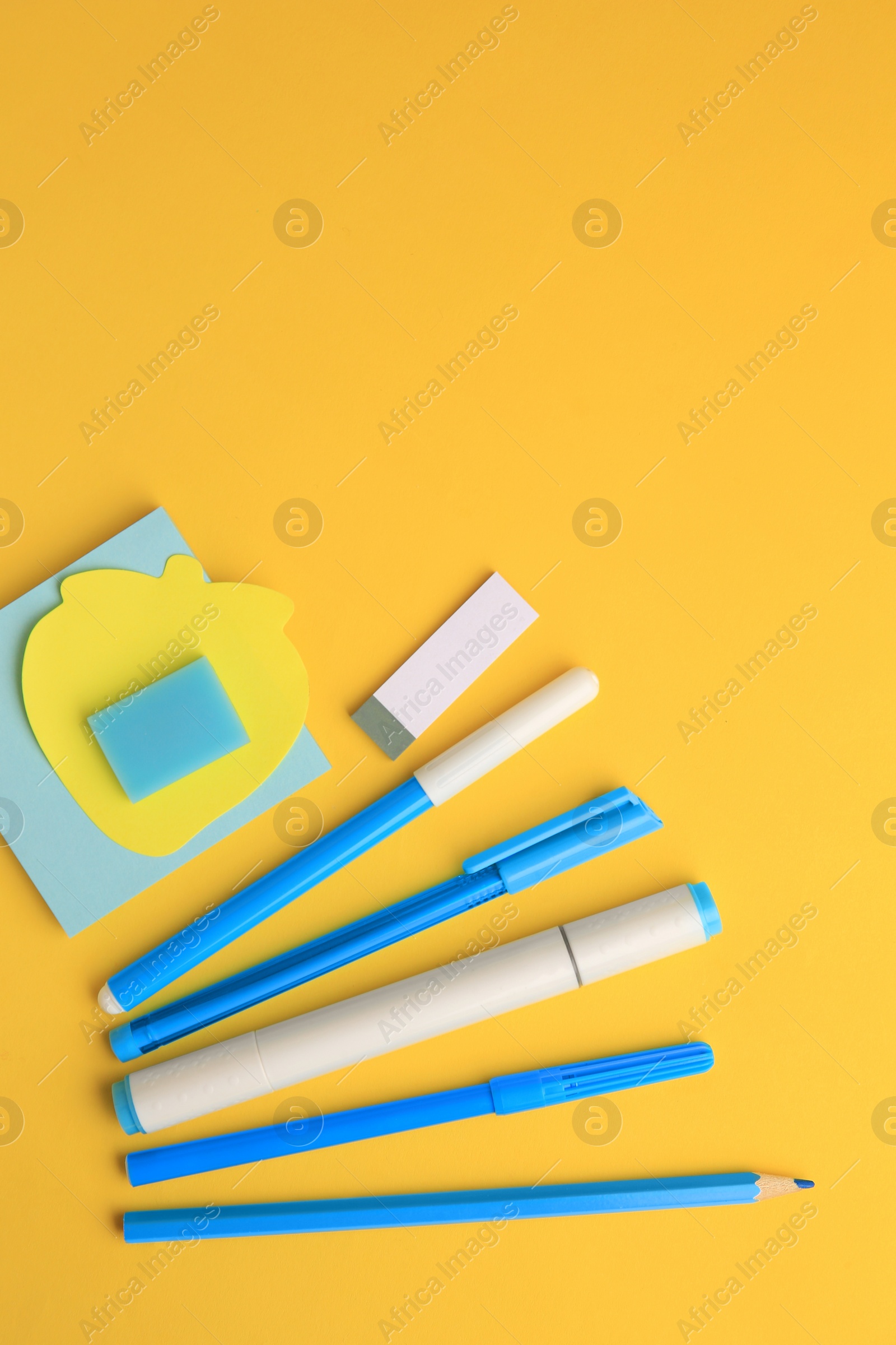 Photo of Flat lay composition with different school stationery on yellow background, space for text. Back to school