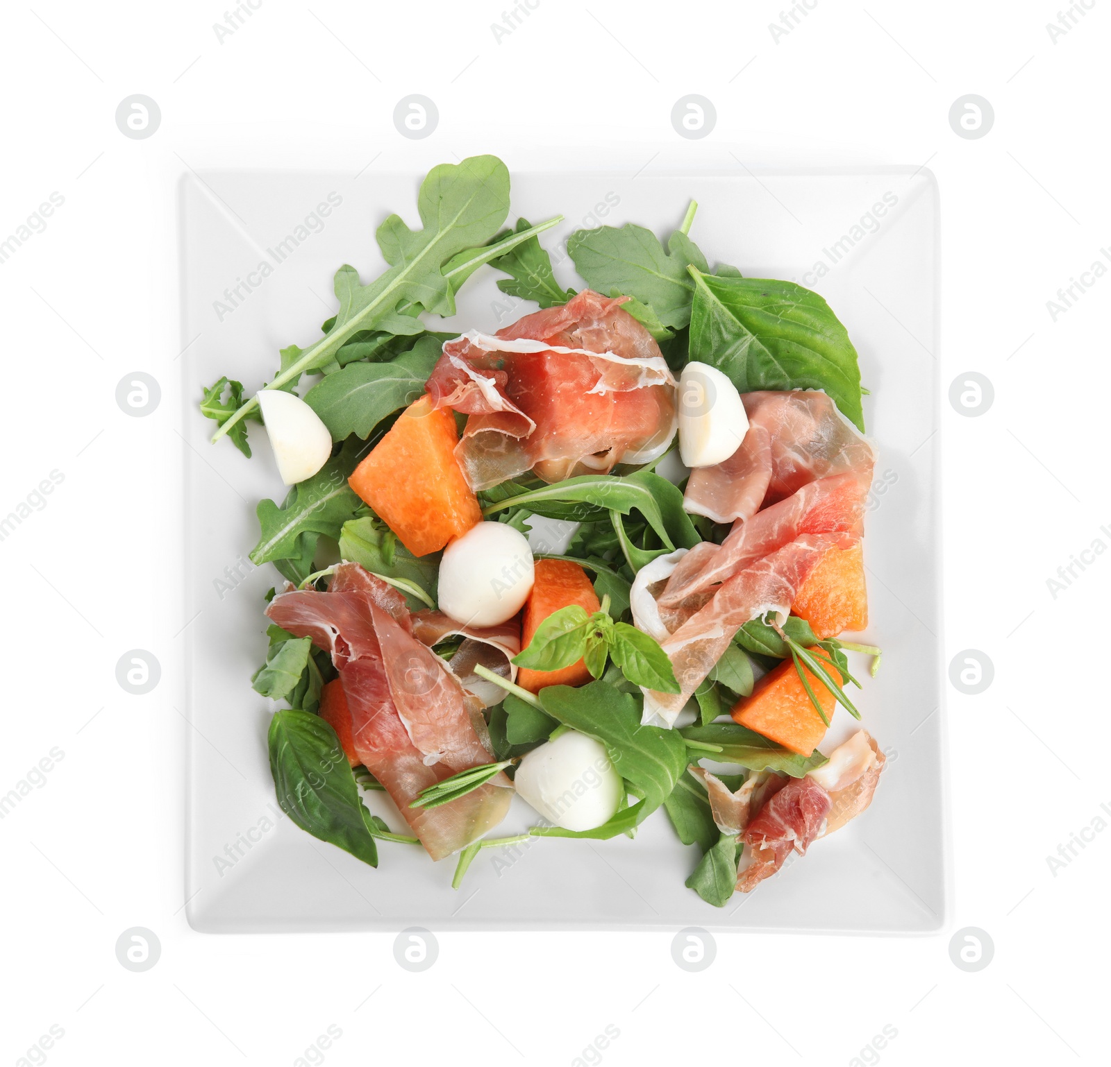 Photo of Fresh melon with prosciutto, mozzarella and arugula on white background, top view