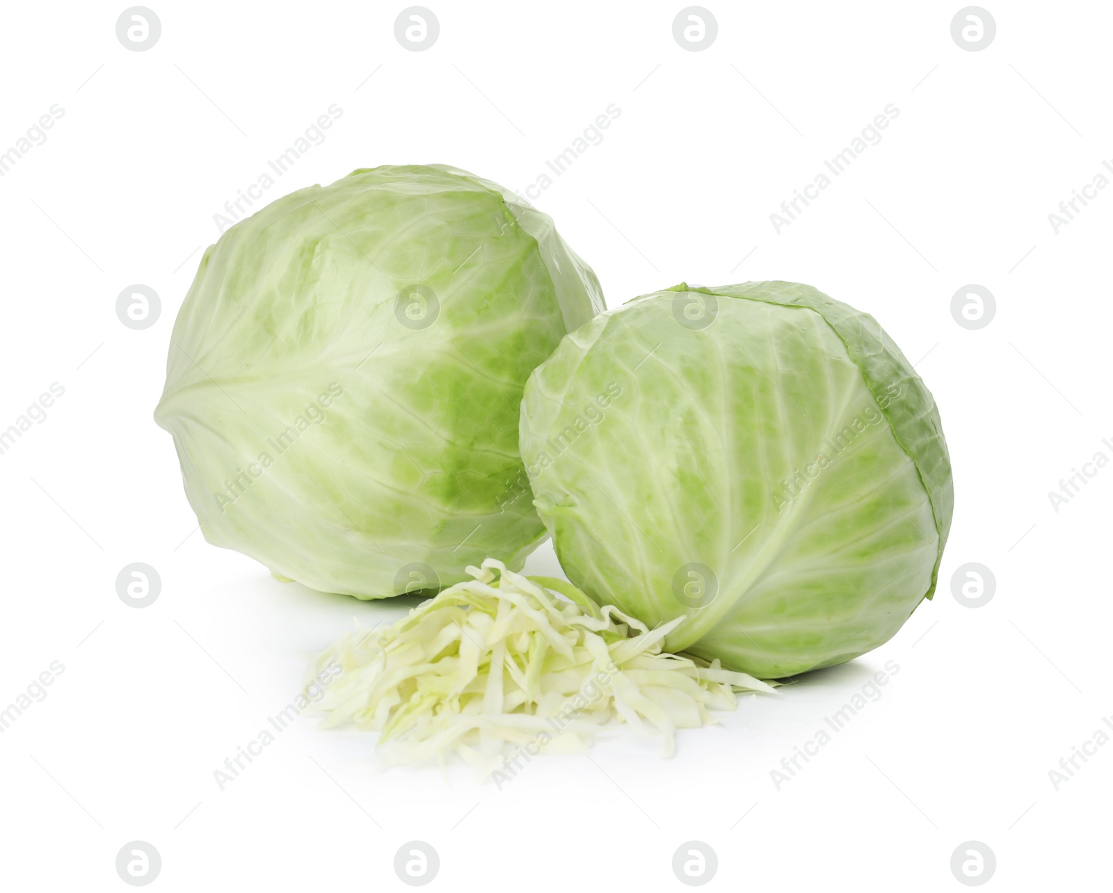 Photo of Whole and cut fresh ripe cabbages on white background