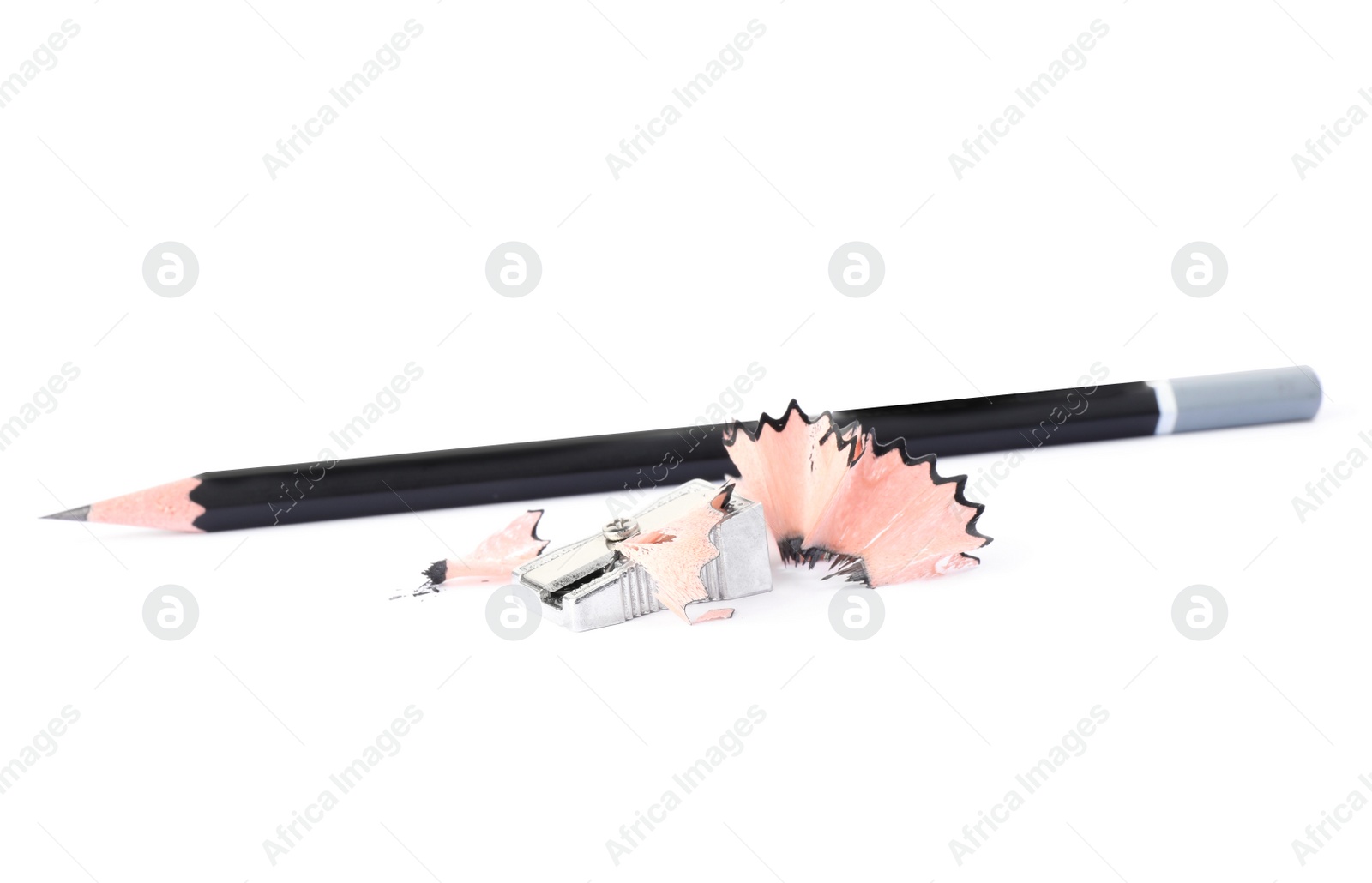 Photo of Metal sharpener with shavings and pencil on white background