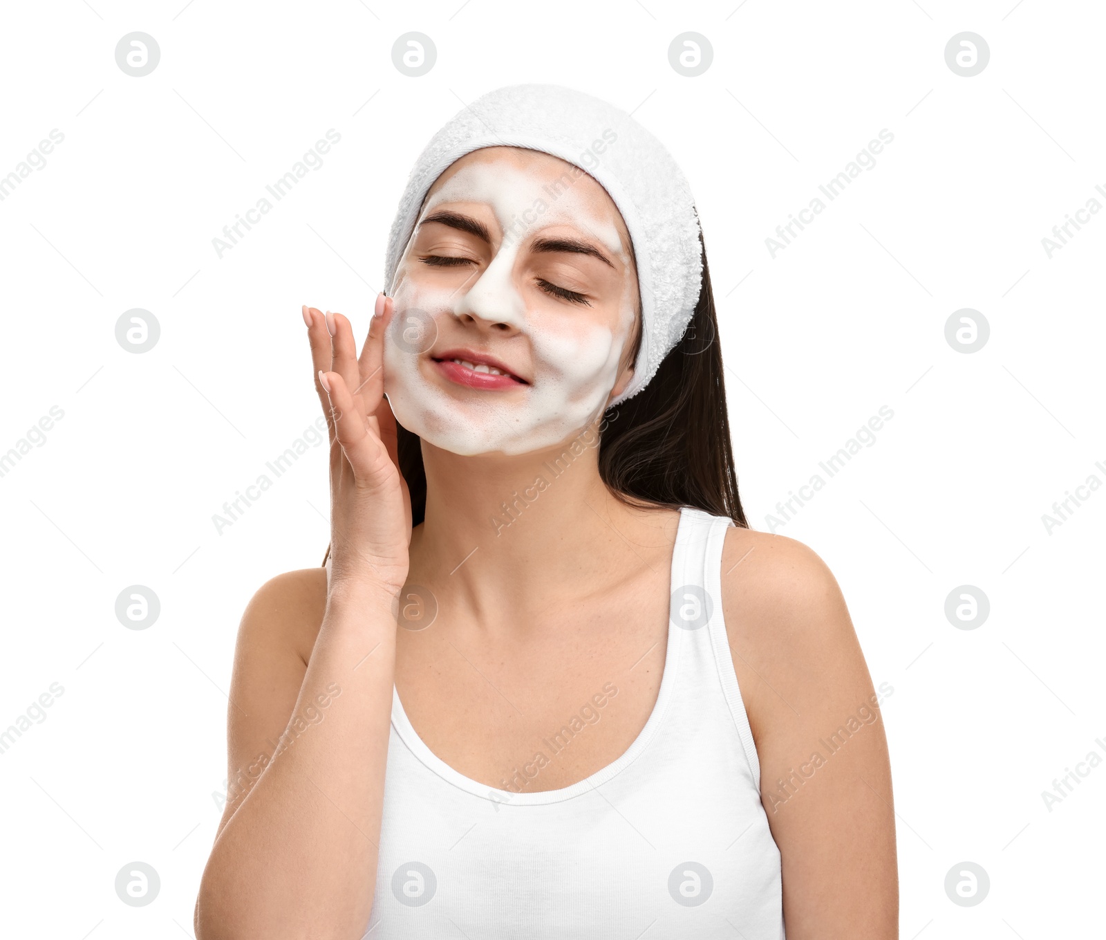 Photo of Young woman with headband washing her face on white background