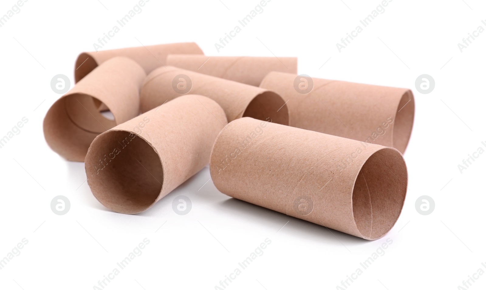 Photo of Empty paper toilet rolls on white background