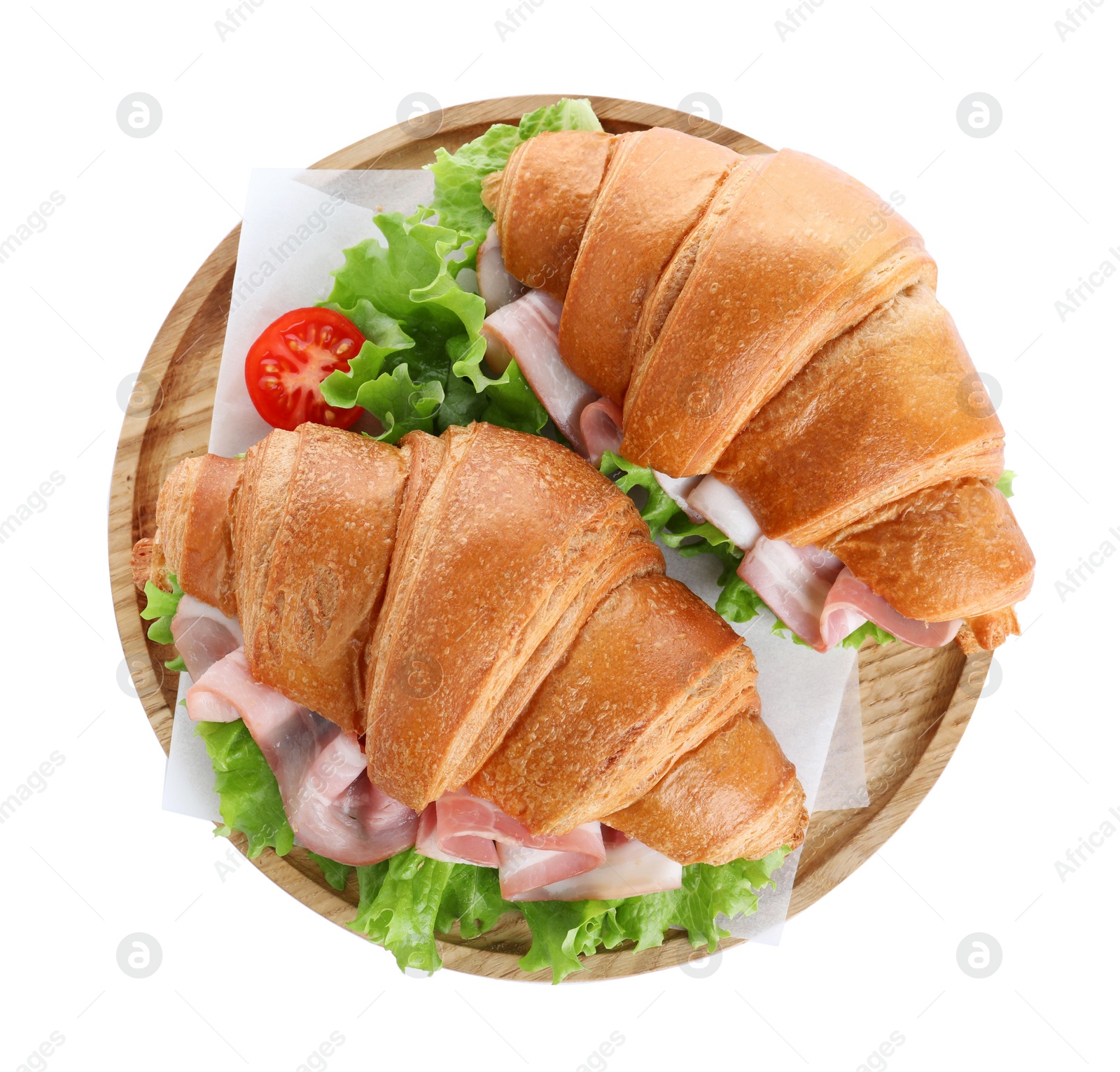 Photo of Wooden tray with tasty croissant sandwiches isolated on white, top view