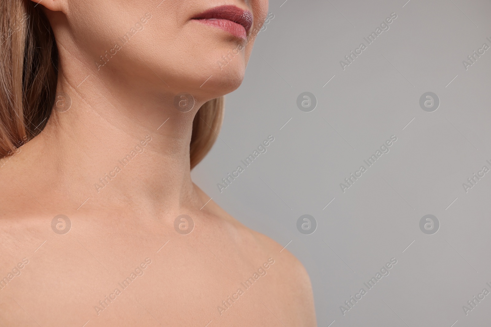 Photo of Woman with healthy skin on grey background, closeup. Space for text