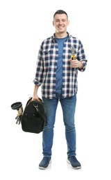 Young plumber with tool bag on white background