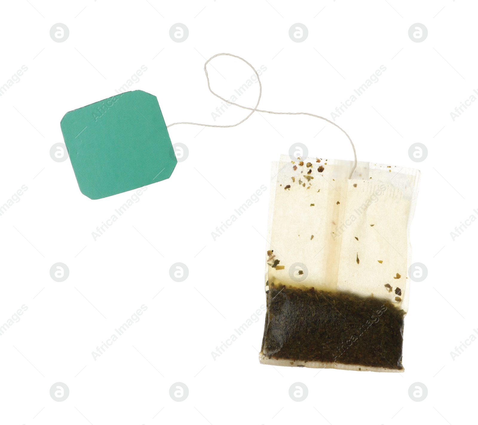 Photo of Used tea bag with tag isolated on white