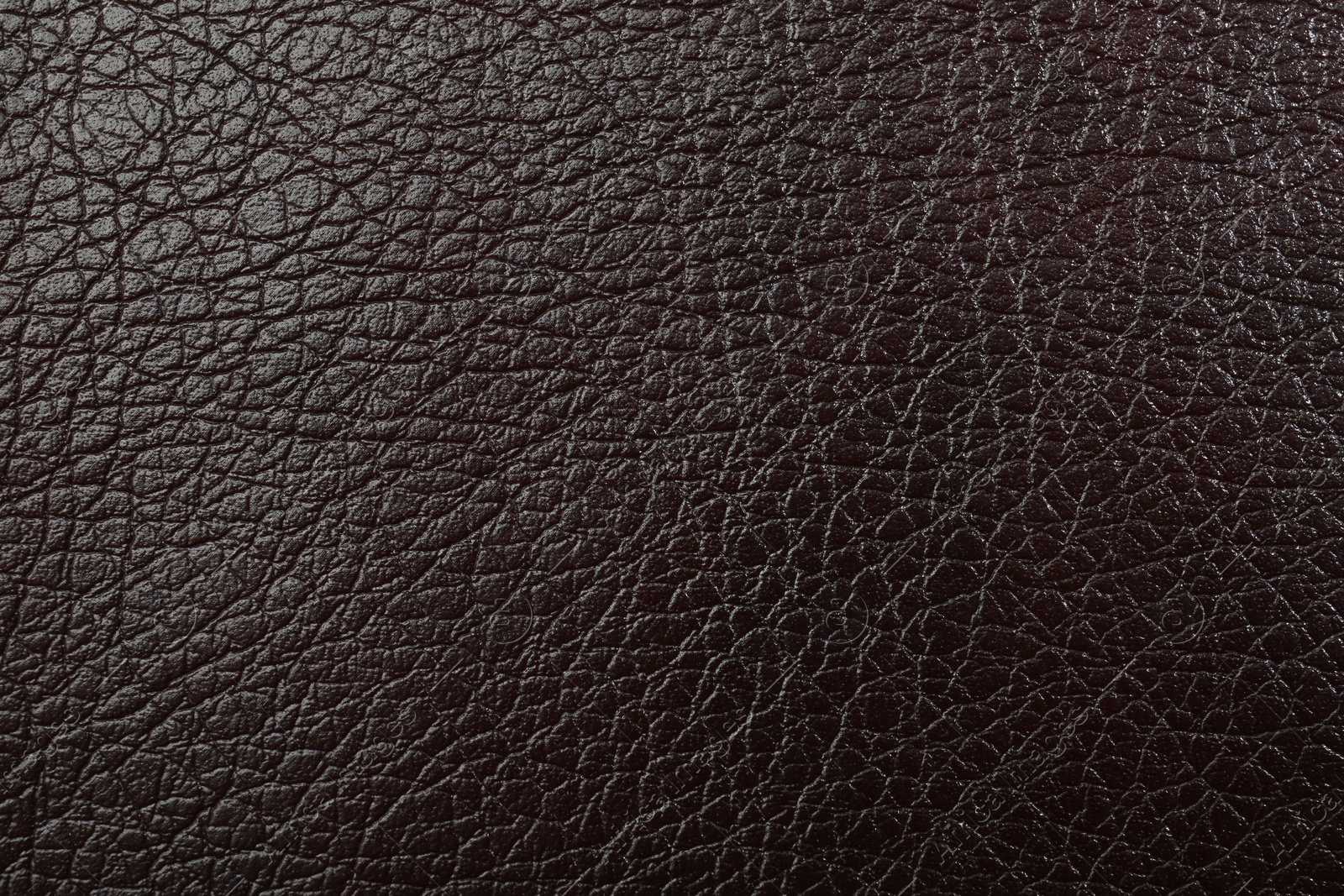 Photo of Texture of brown leather as background, top view