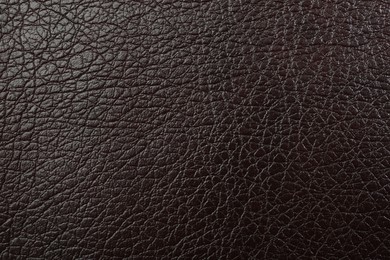 Photo of Texture of brown leather as background, top view