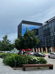 Photo of WARSAW, POLAND - JULY 11, 2022: Beautiful view of modern office building on city street