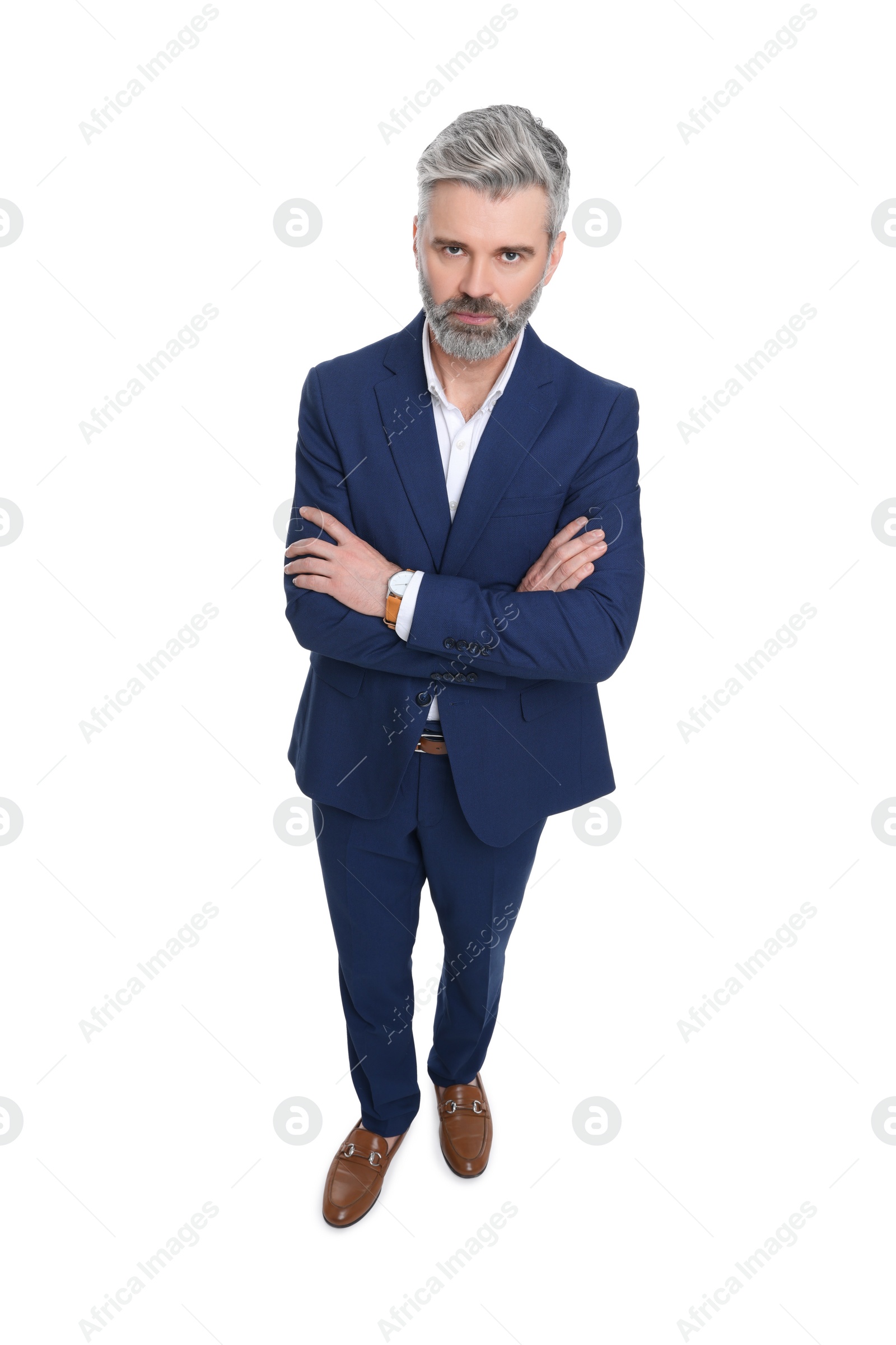 Photo of Mature businessman in stylish clothes posing on white background