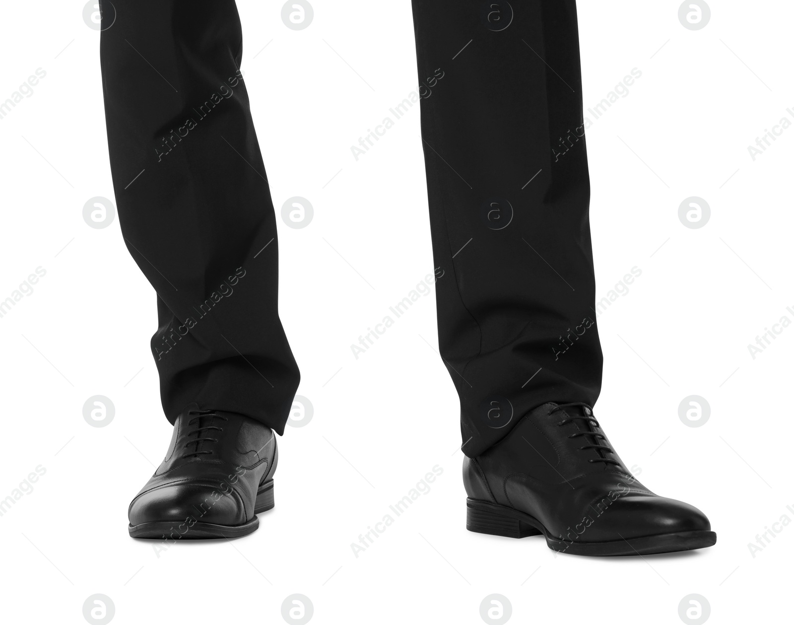 Photo of Businessman in leather shoes on white background, closeup