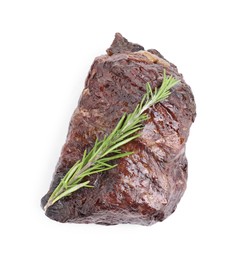 Piece of delicious grilled beef meat and rosemary isolated on white, above view