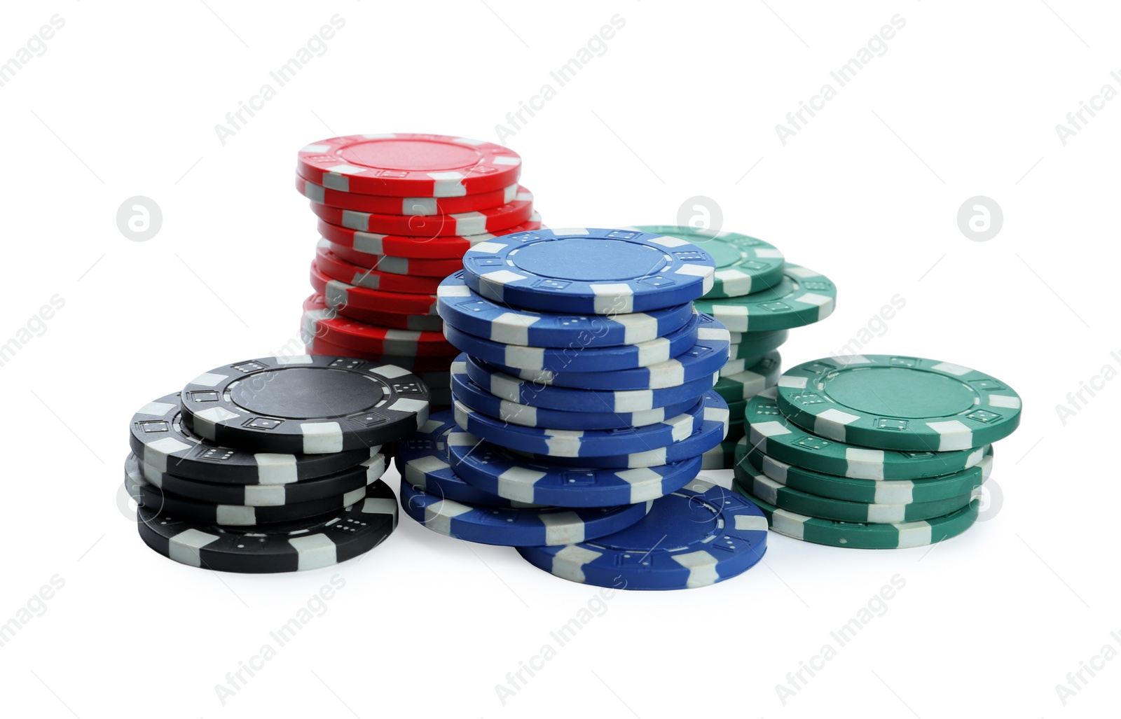 Photo of Plastic casino chips stacked on white background. Poker game