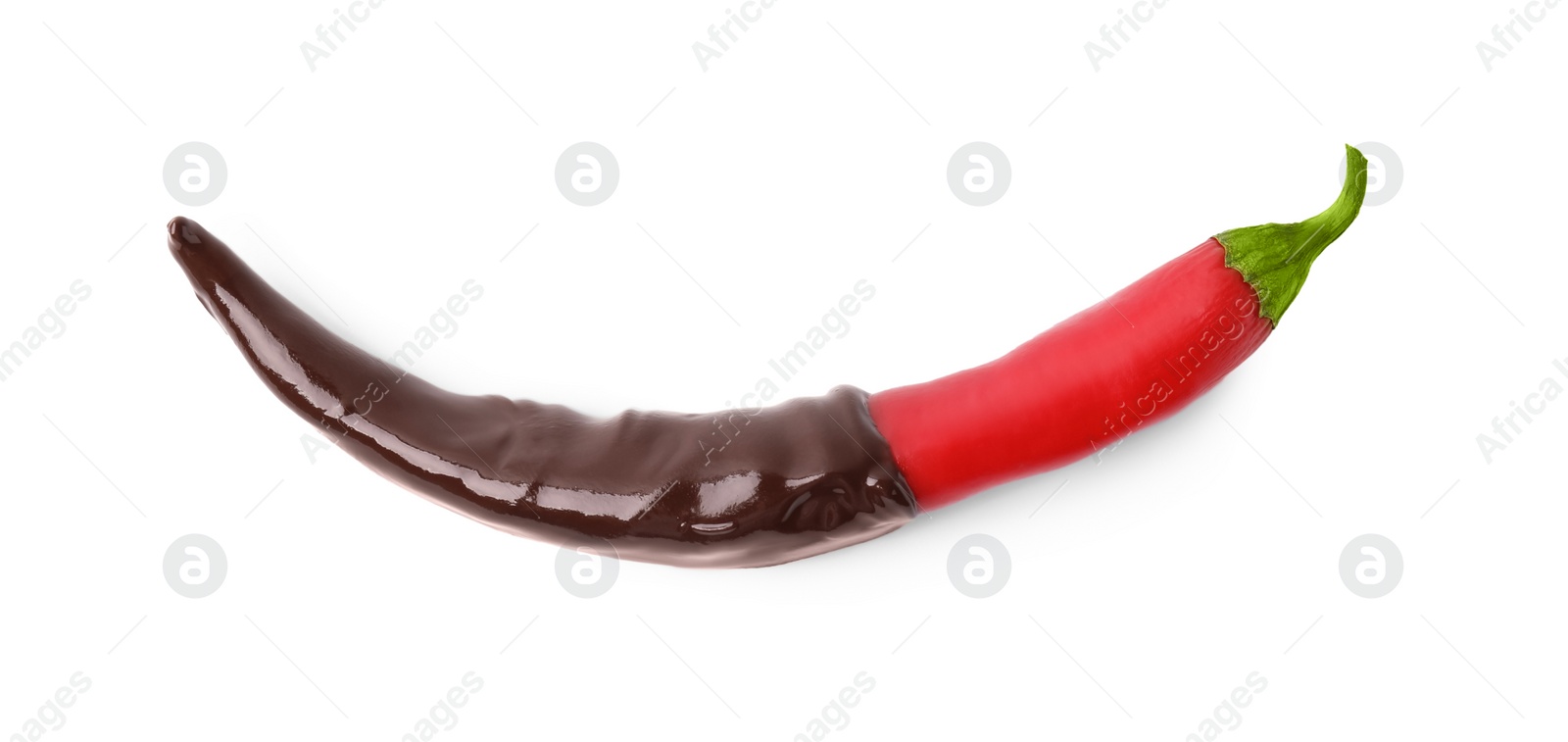 Photo of Red hot chili pepper in chocolate isolated on white, top view