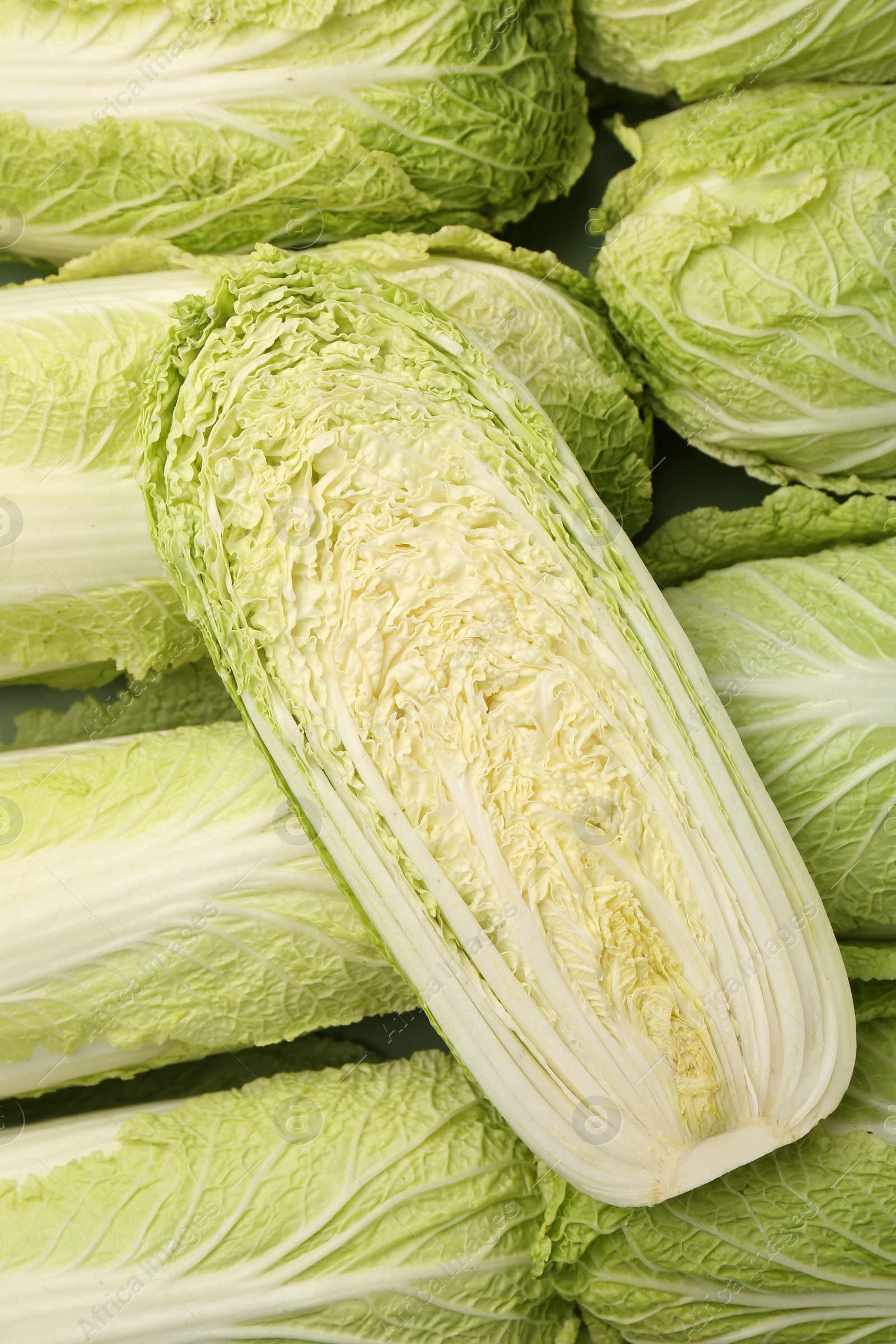 Photo of Fresh ripe Chinese cabbages as background, top view