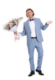 Photo of Young handsome man in stylish suit with beautiful flower bouquet on white background