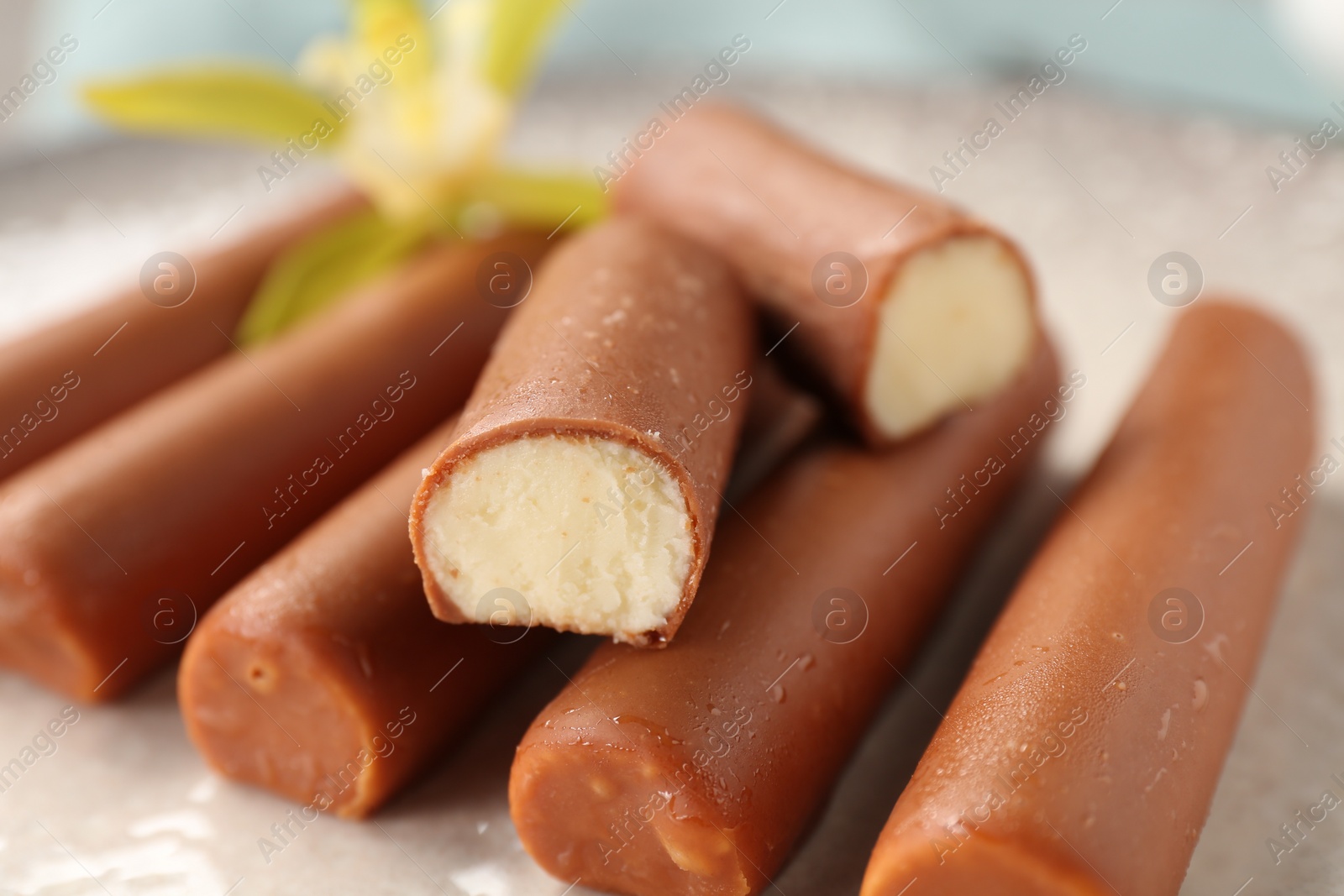 Photo of Glazed curd cheese bars on plate, closeup