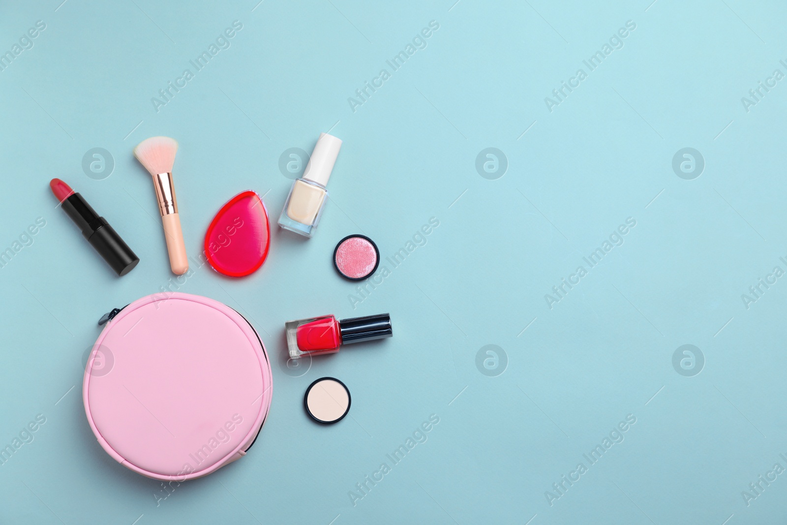 Photo of Flat lay composition with cosmetic products on color background