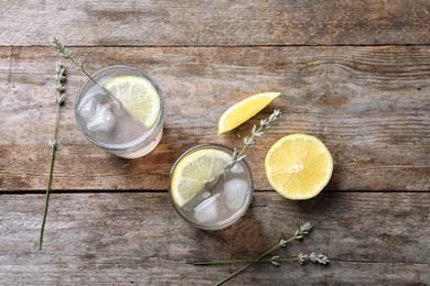 Photo of Flat lay composition with natural lemonade on wooden background
