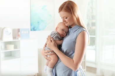 Happy mother and her baby at home