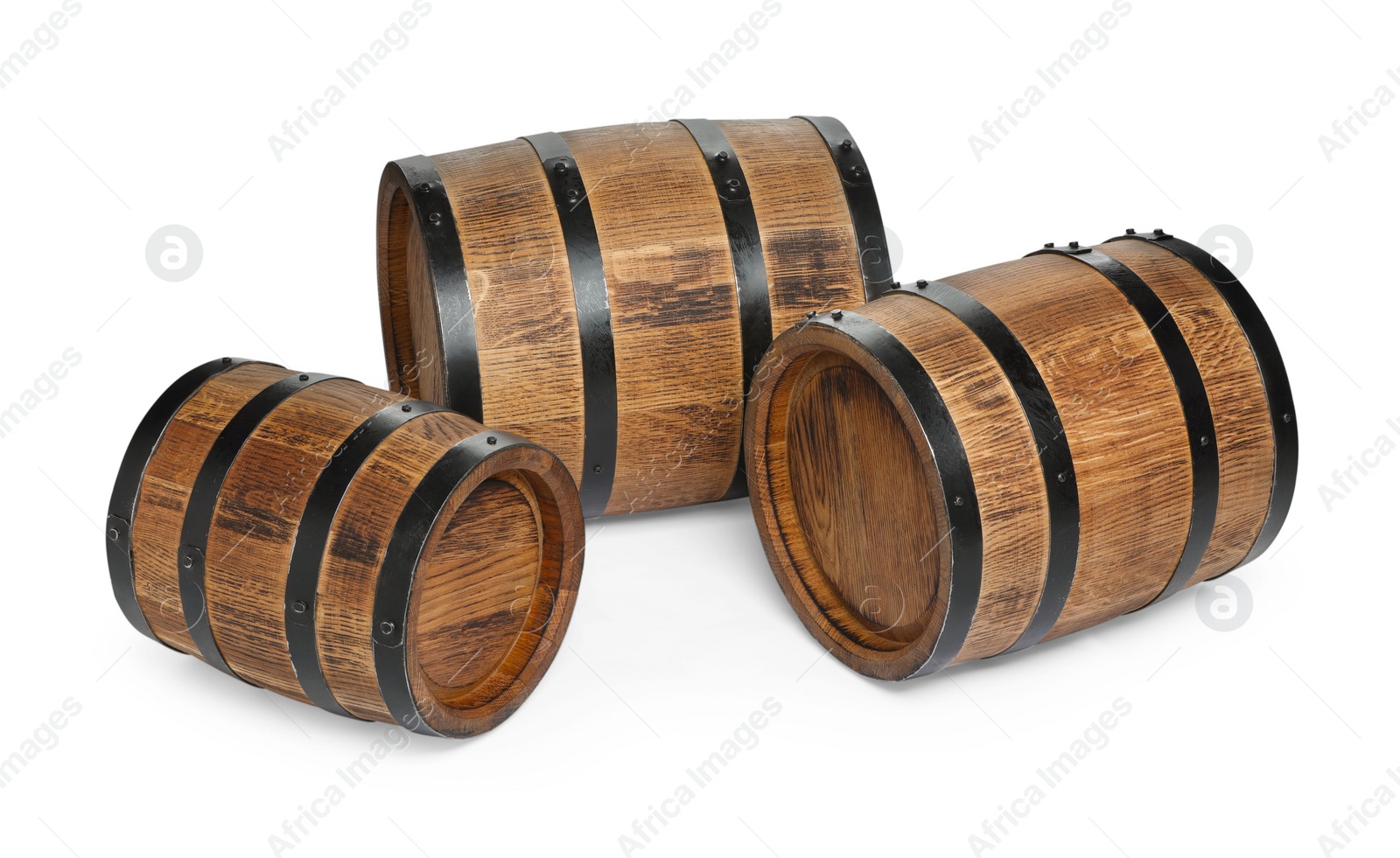 Photo of Three traditional wooden barrels on white background