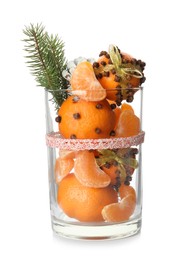 Christmas composition with tangerine pomander balls in glass isolated on white