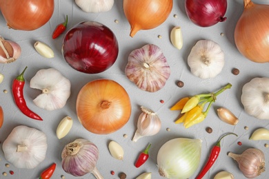 Photo of Flat lay composition with garlic and onion on table