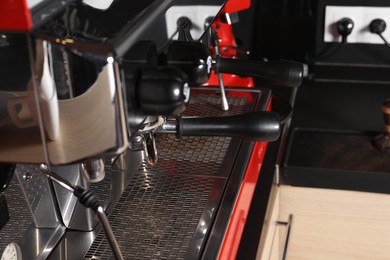 Photo of Professional coffee machine in cafe, closeup view