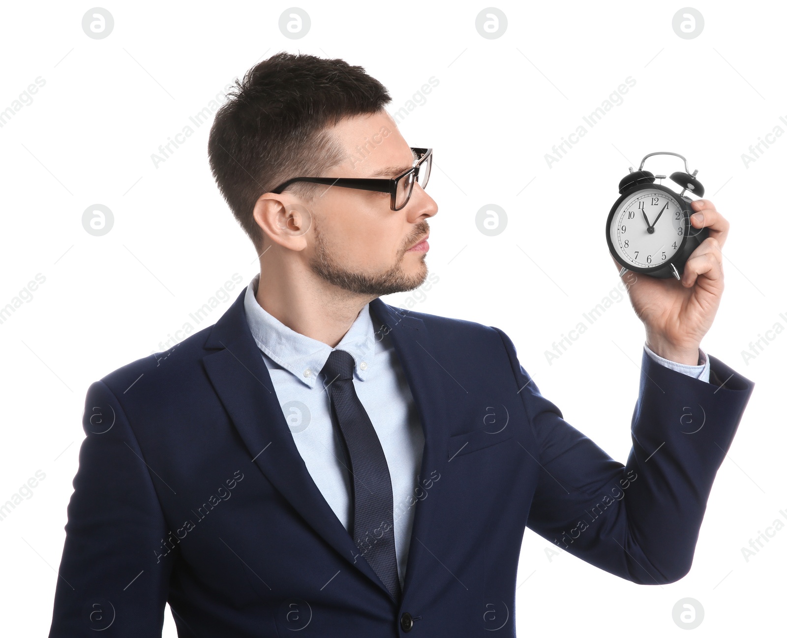 Photo of Businessman holding alarm clock on white background. Time management