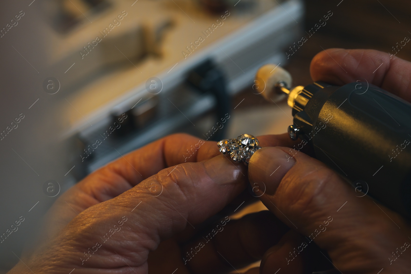 Photo of Professional jeweler working with gemstones, closeup view