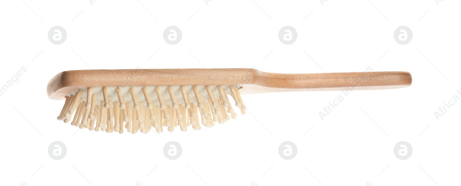 Photo of New wooden hair brush isolated on white