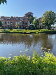 Photo of Picturesque view of lake and buildings in city