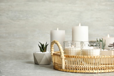 Photo of Beautiful composition with burning candles on table. Space for text