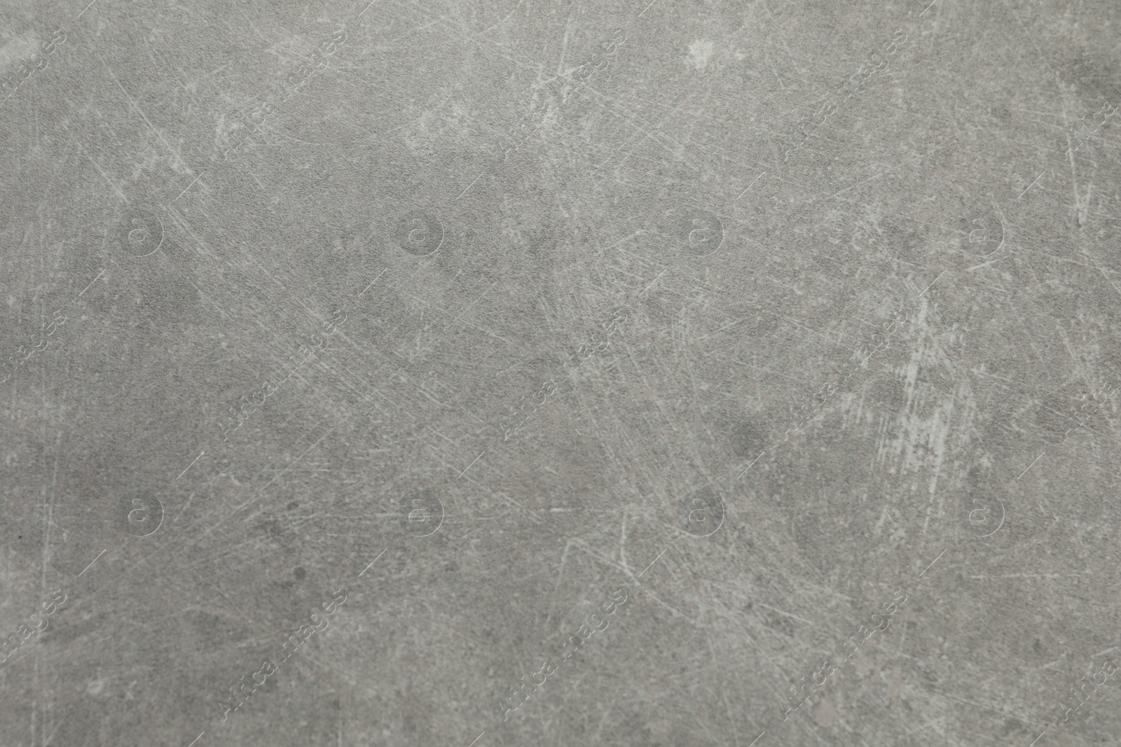 Photo of Texture of light grey stone surface as background, closeup