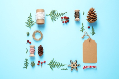 Flat lay composition with Christmas items and space for text on blue background