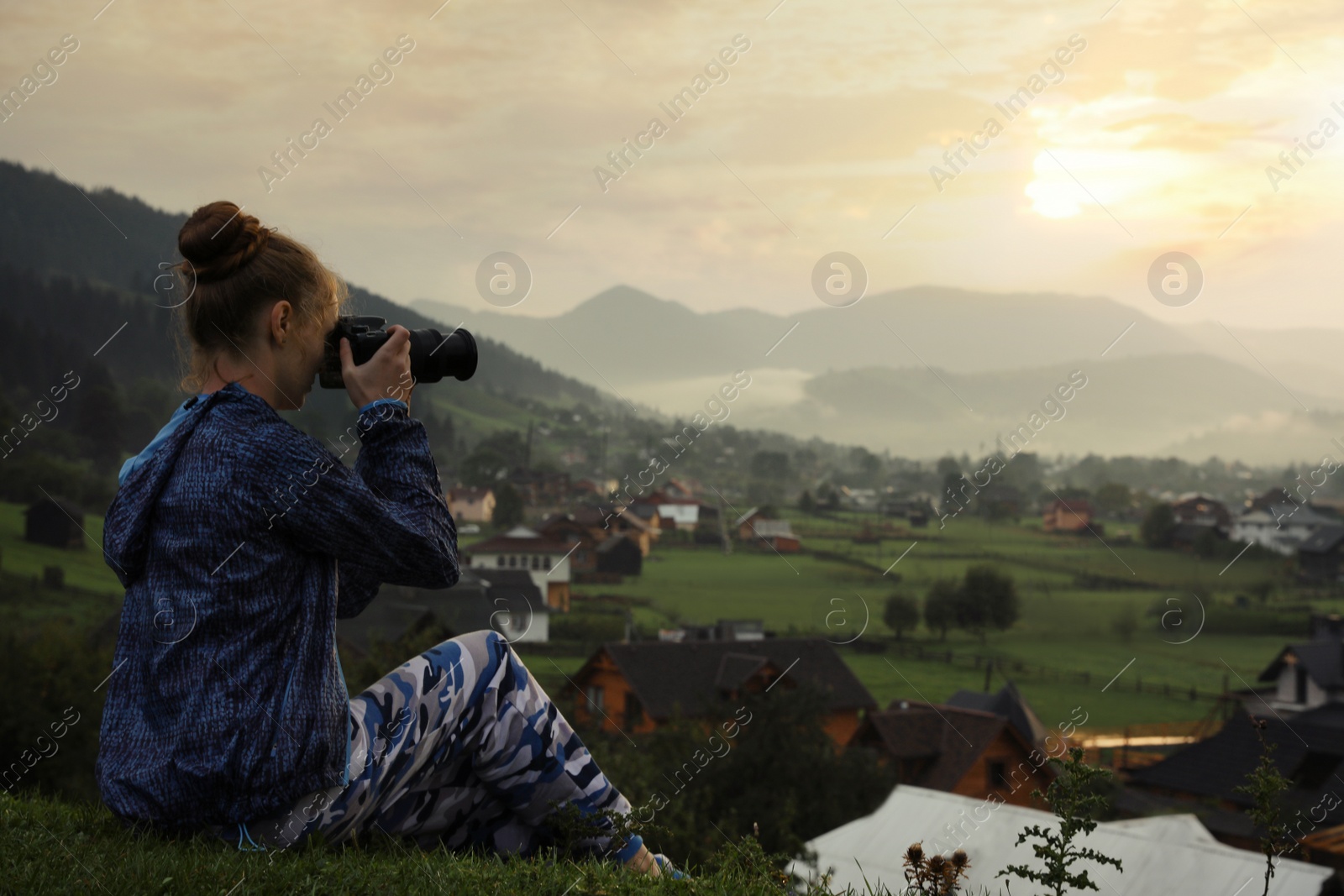 Photo of Professional nature photographer taking photos in mountains