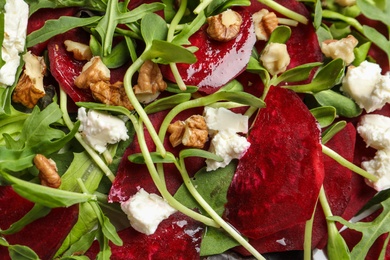 Delicious salad with beet as background, closeup