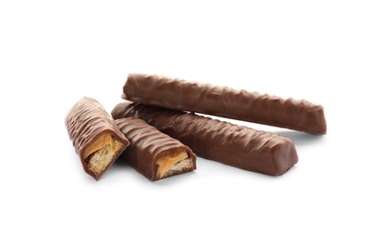 Photo of Sweet tasty chocolate bars with caramel on white background