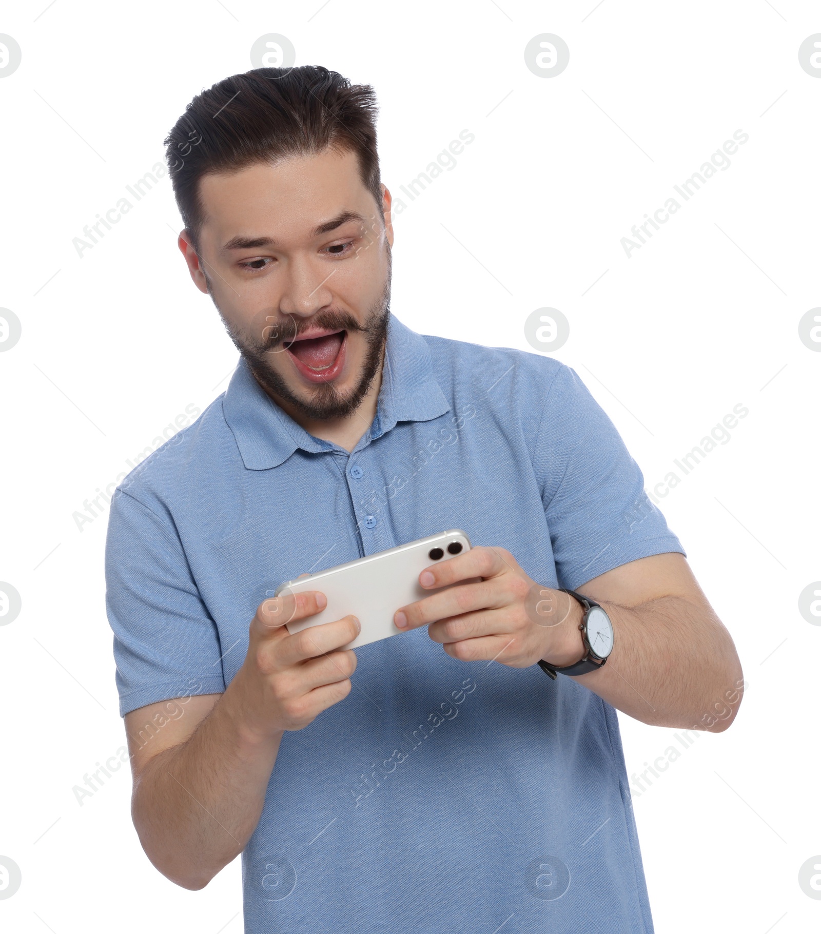 Photo of Emotional man playing game on phone against white background