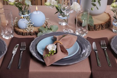 Photo of Elegant table setting with beautiful floral decor and burning candles