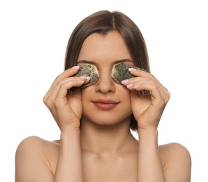 Young woman with tea bags on white background. Eye skin care