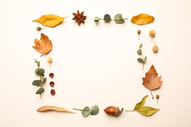 Photo of Flat lay composition with autumn leaves on light background, space for text