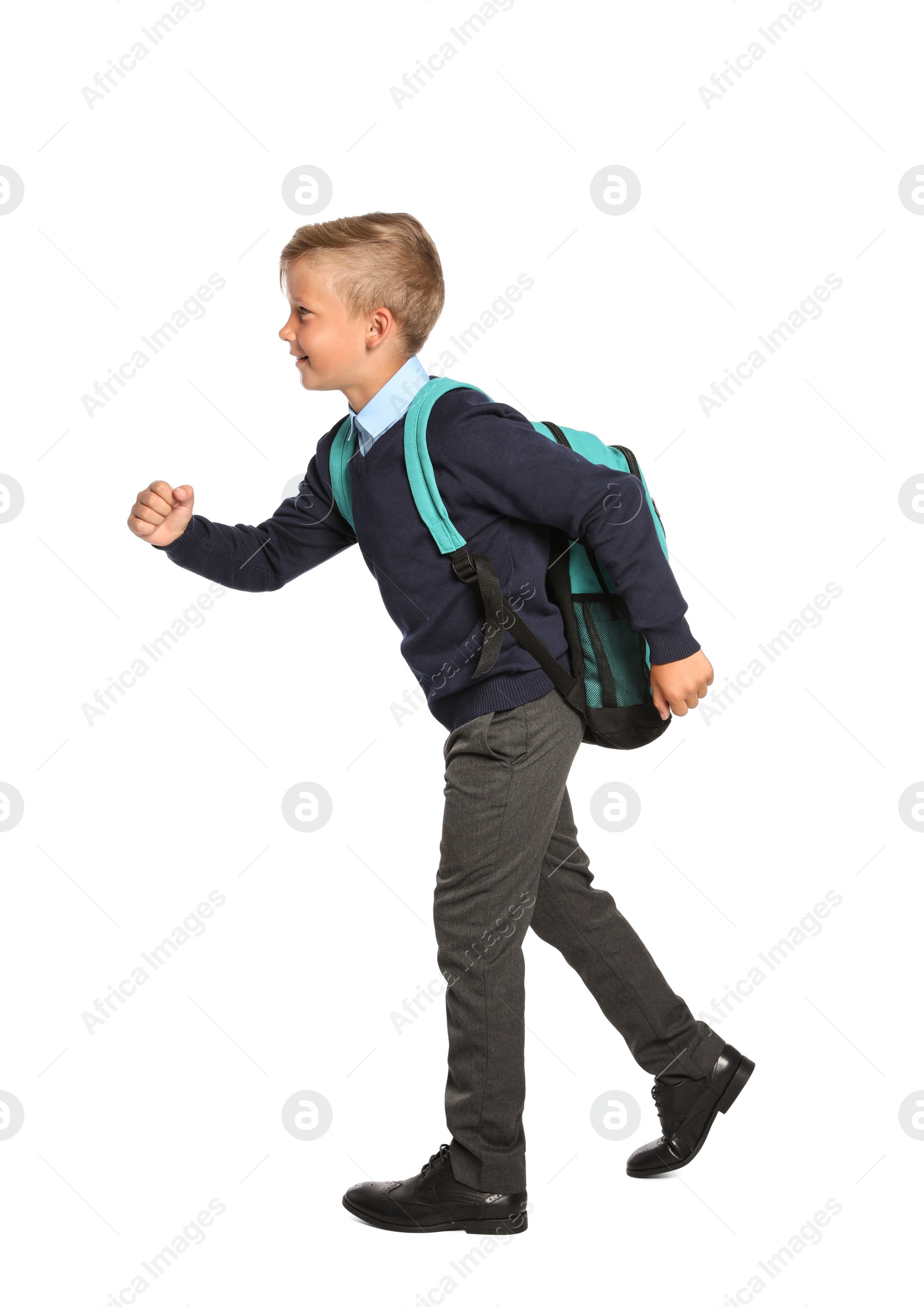 Photo of Little boy in stylish school uniform on white background