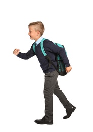 Little boy in stylish school uniform on white background