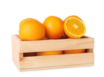 Wooden crate full of fresh oranges on white background