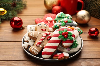 Delicious homemade Christmas cookies and festive decor on wooden table