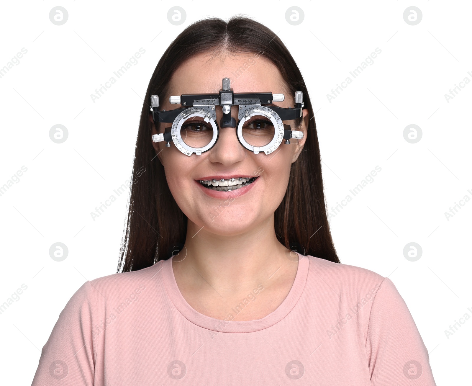 Photo of Vision testing. Young woman with trial frame on white background