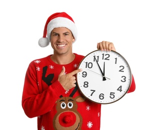 Photo of Man in Santa hat with clock on white background. New Year countdown