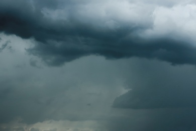 Photo of Sky with heavy rainy clouds on grey day